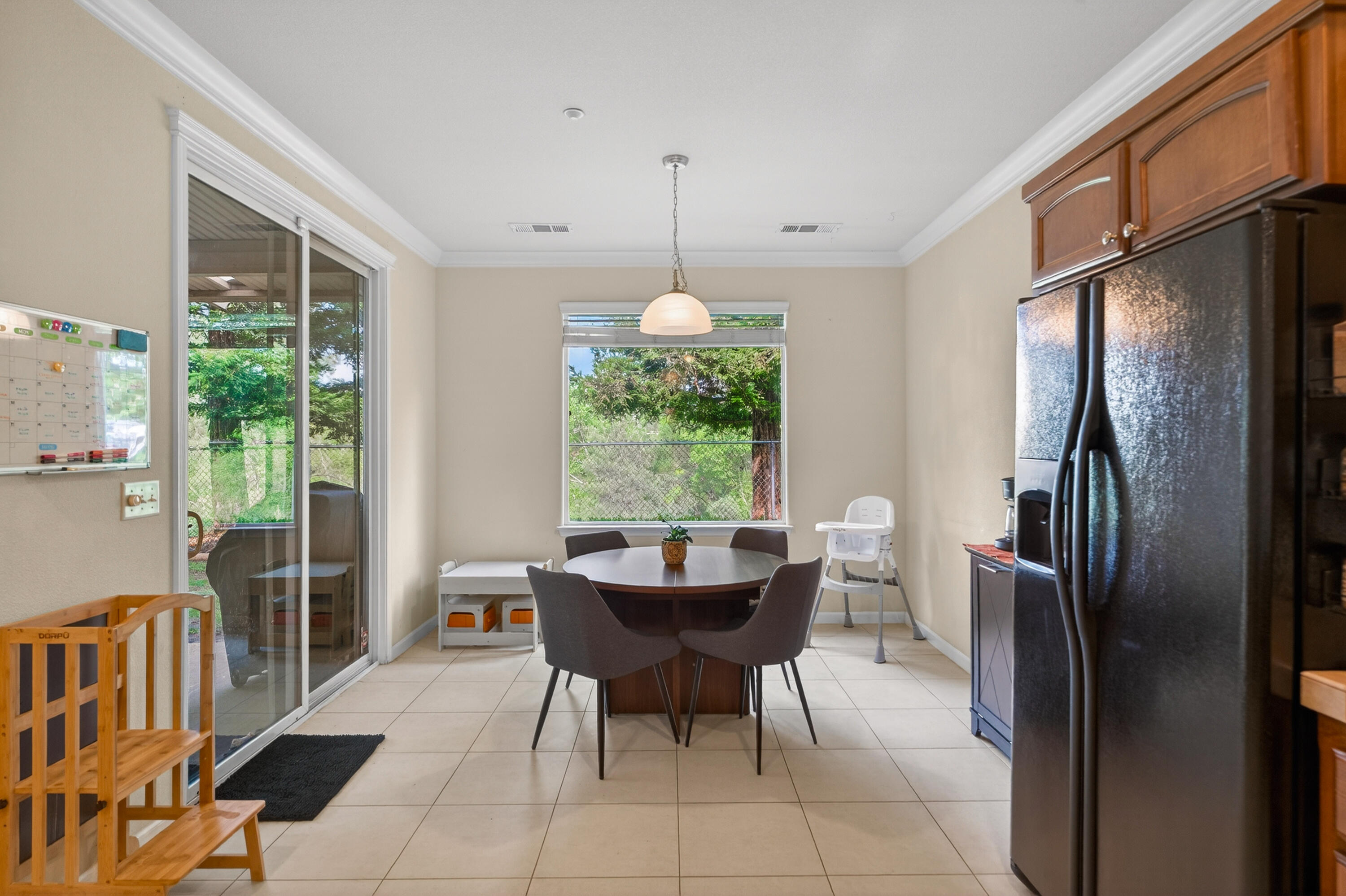 2090 Tuscany Way Redding, CA 96003 - Photo 15 of 37 a dining room with furniture a chandelier and window