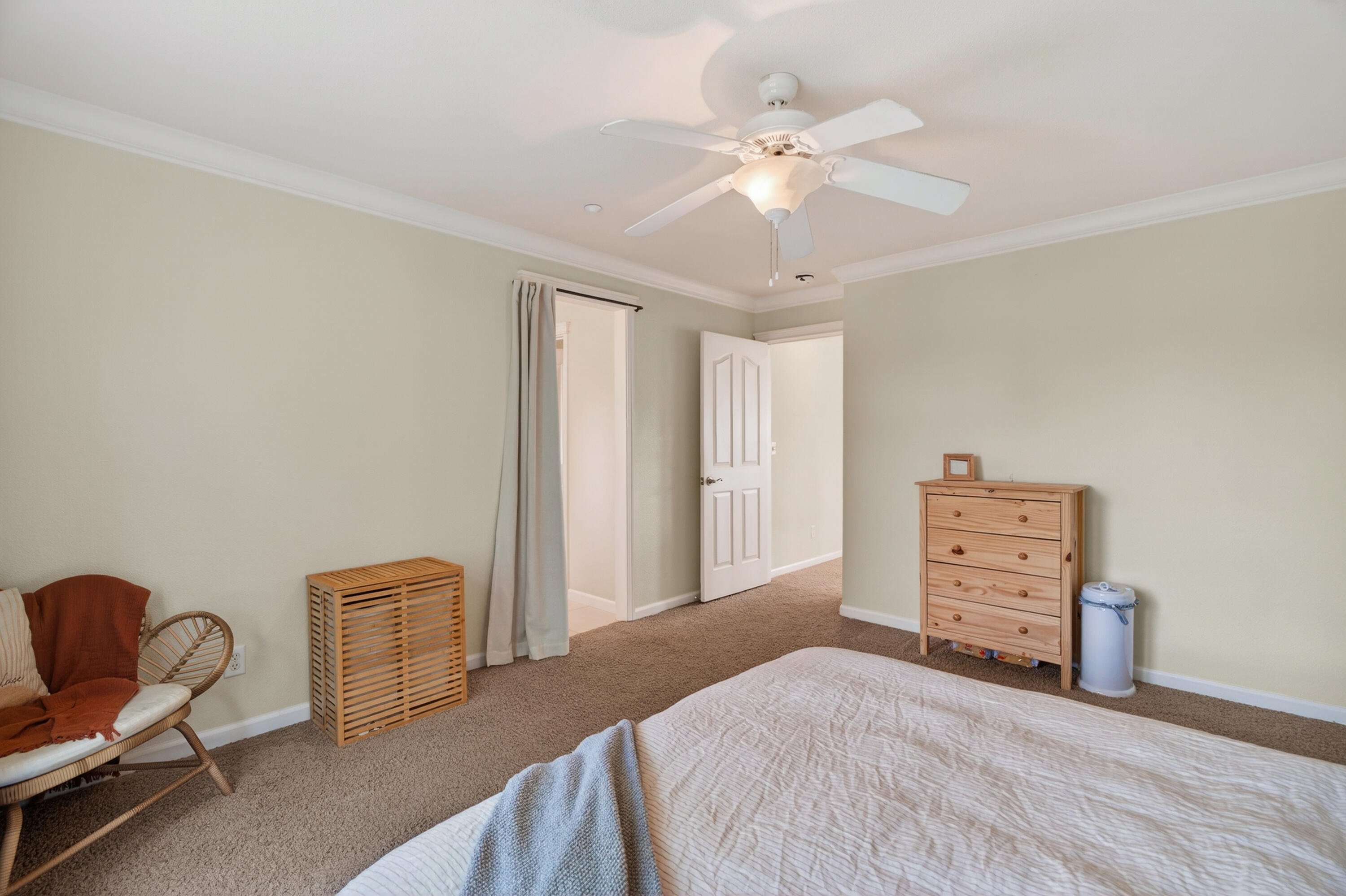 2090 Tuscany Way Redding, CA 96003 - Photo 21 of 37 a bedroom with furniture and a chandelier