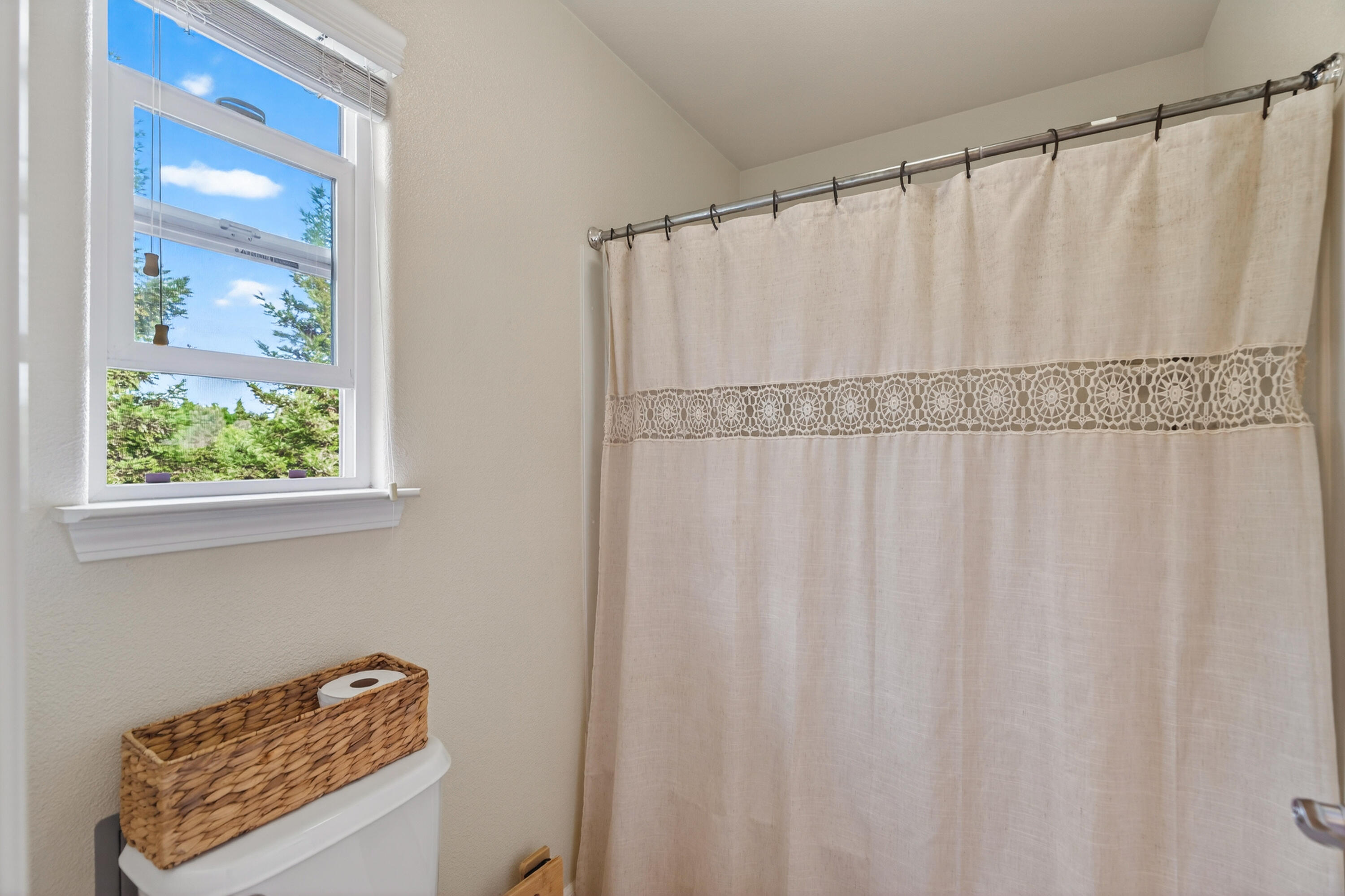 2090 Tuscany Way Redding, CA 96003 - Photo 25 of 37 a bathroom with a shower curtain and a window