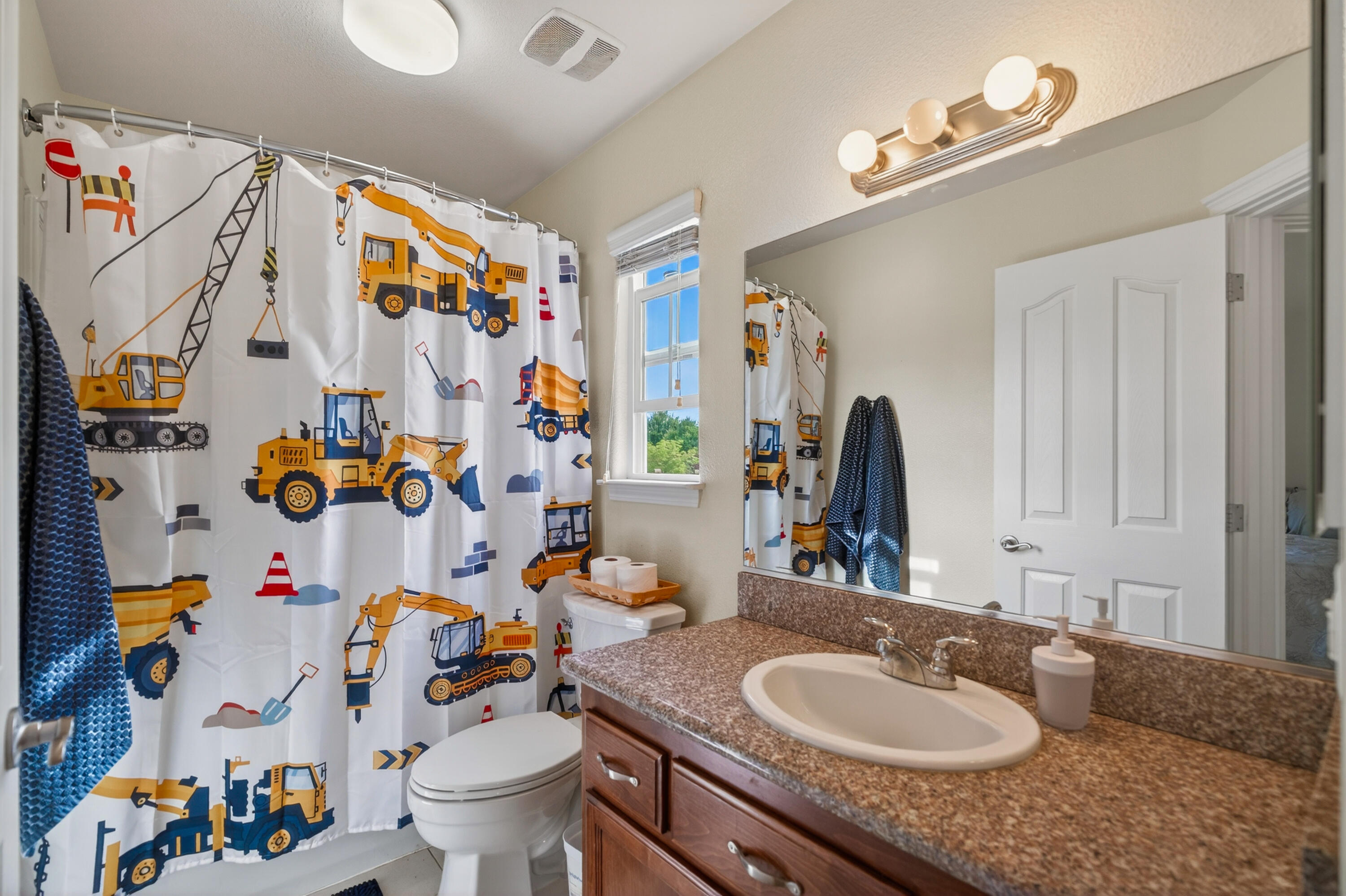 2090 Tuscany Way Redding, CA 96003 - Photo 29 of 37 a bathroom with a sink mirror and toilet
