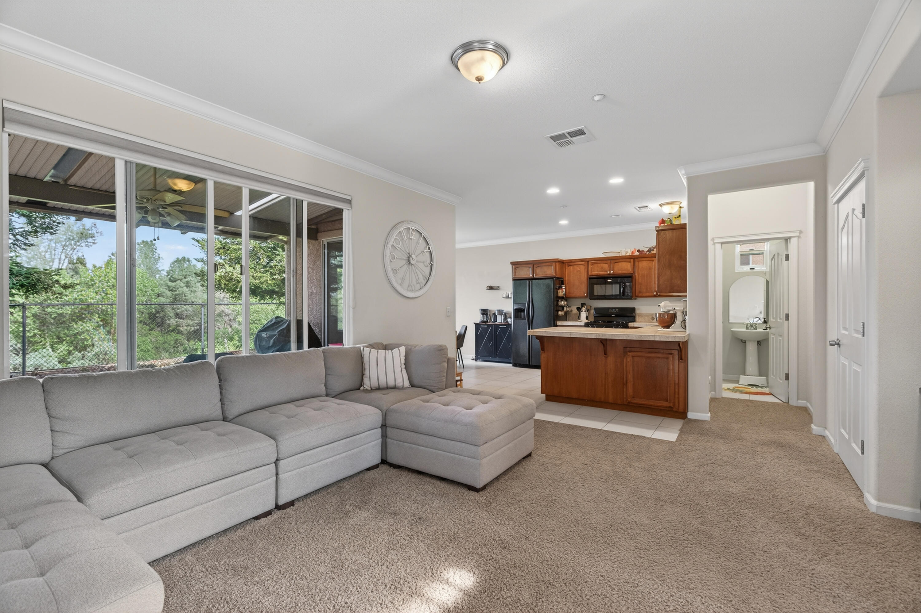 2090 Tuscany Way Redding, CA 96003 - Photo 7 of 37 a living room with furniture and a large window