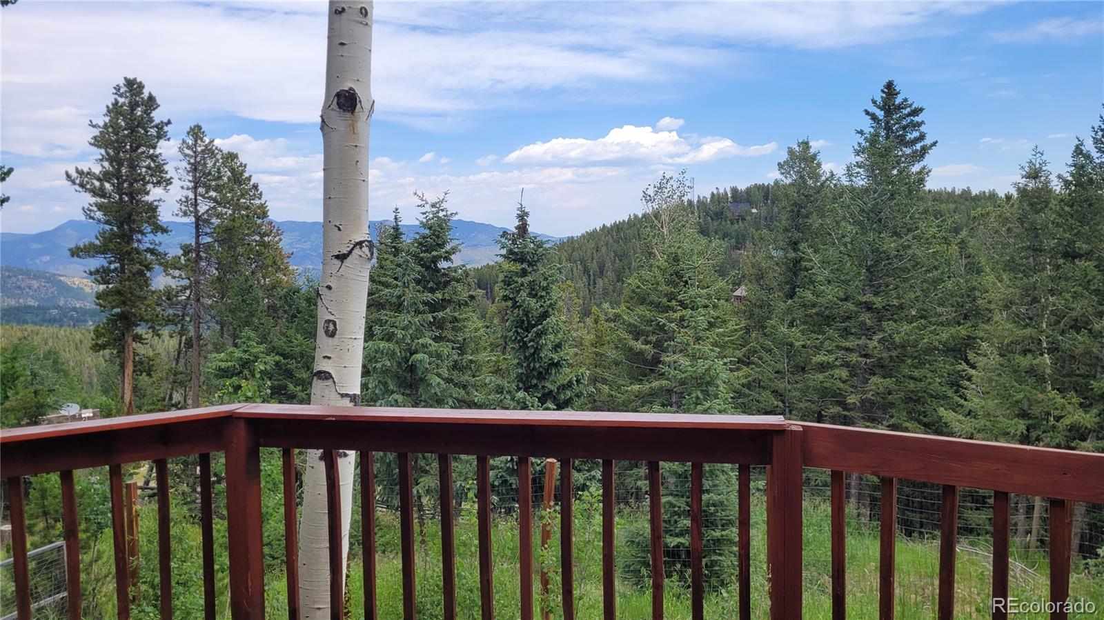 2339 Sinton Road Evergreen, CO 80439 - Photo 11 of 16 a view of a balcony with trees