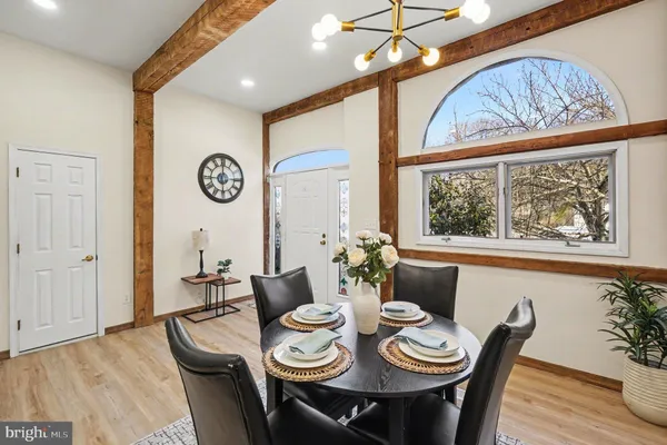 a view of a dining room with furniture window and wooden floor