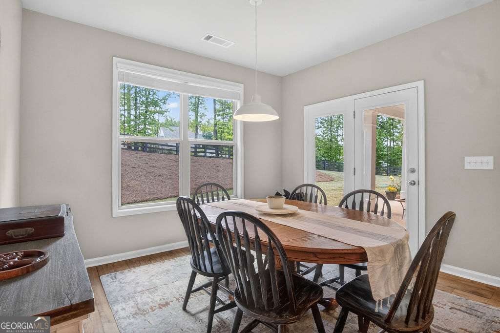280 Greystone Court Winder, GA 30680 - Photo 18 of 40 a view of a dining room with furniture window and outside view