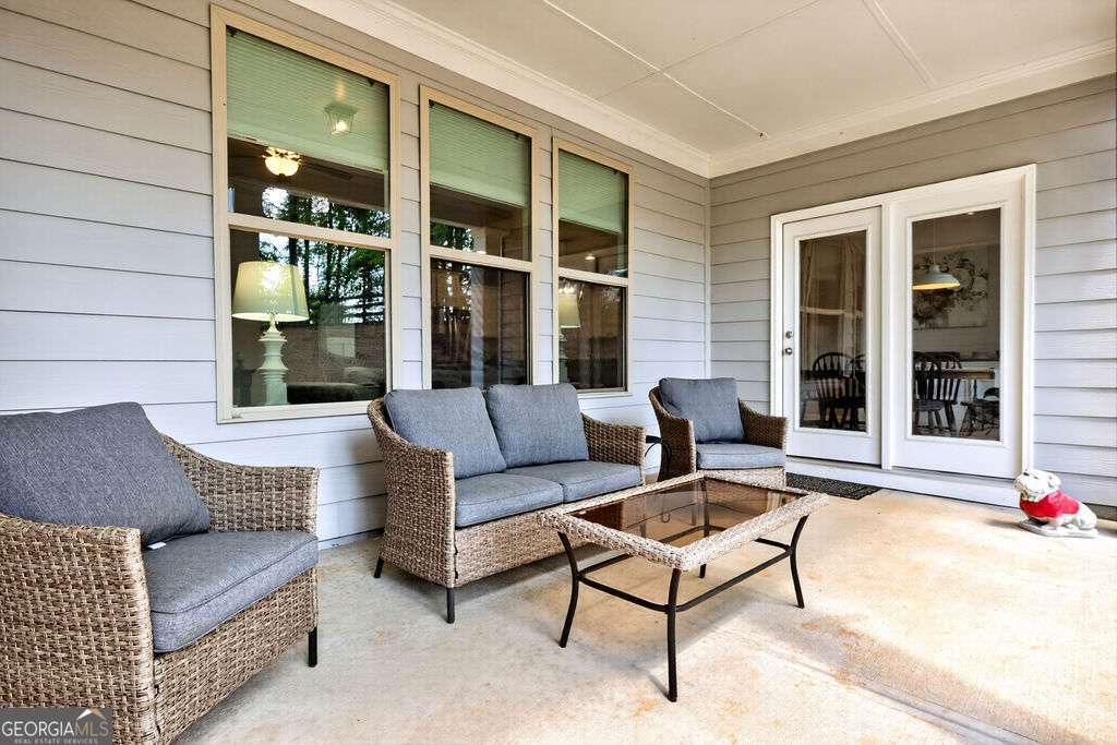 280 Greystone Court Winder, GA 30680 - Photo 19 of 40 a outdoor living space with furniture and a potted plant