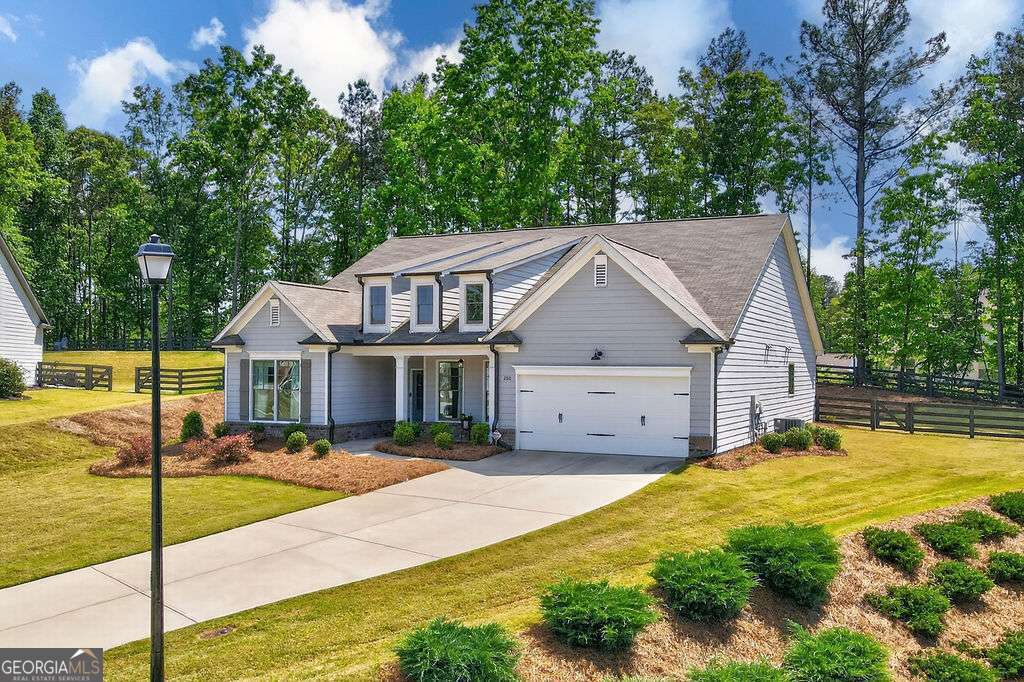 280 Greystone Court Winder, GA 30680 - Photo 2 of 40 a view of a house with swimming pool