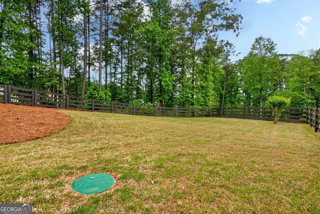 280 Greystone Court Winder, GA 30680 - Photo 39 of 40 a view of a pool with a yard