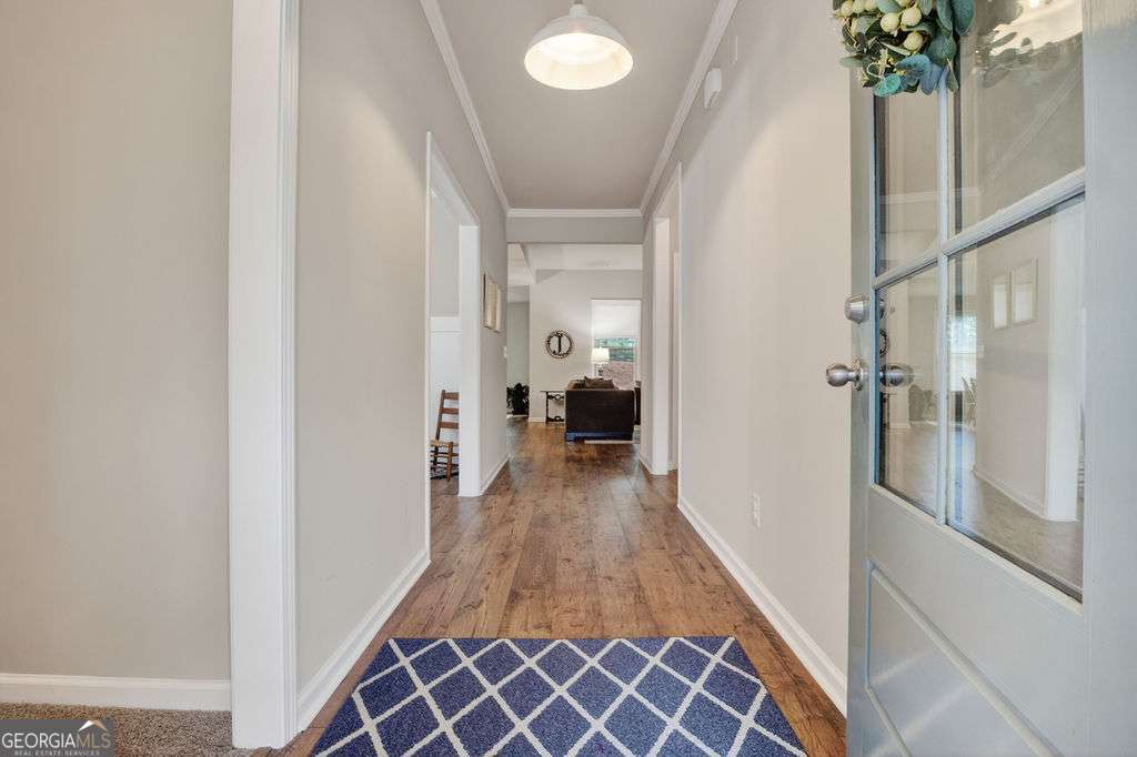 280 Greystone Court Winder, GA 30680 - Photo 4 of 40 a view of a hallway with a livingroom