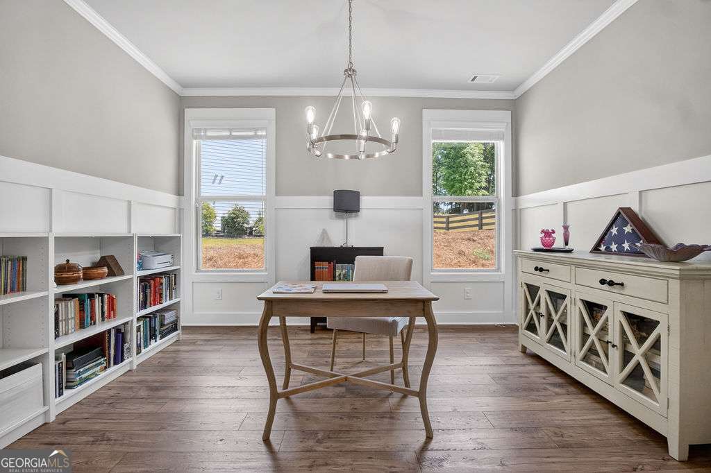 280 Greystone Court Winder, GA 30680 - Photo 5 of 40 a view of a dining room with furniture window and wooden floor