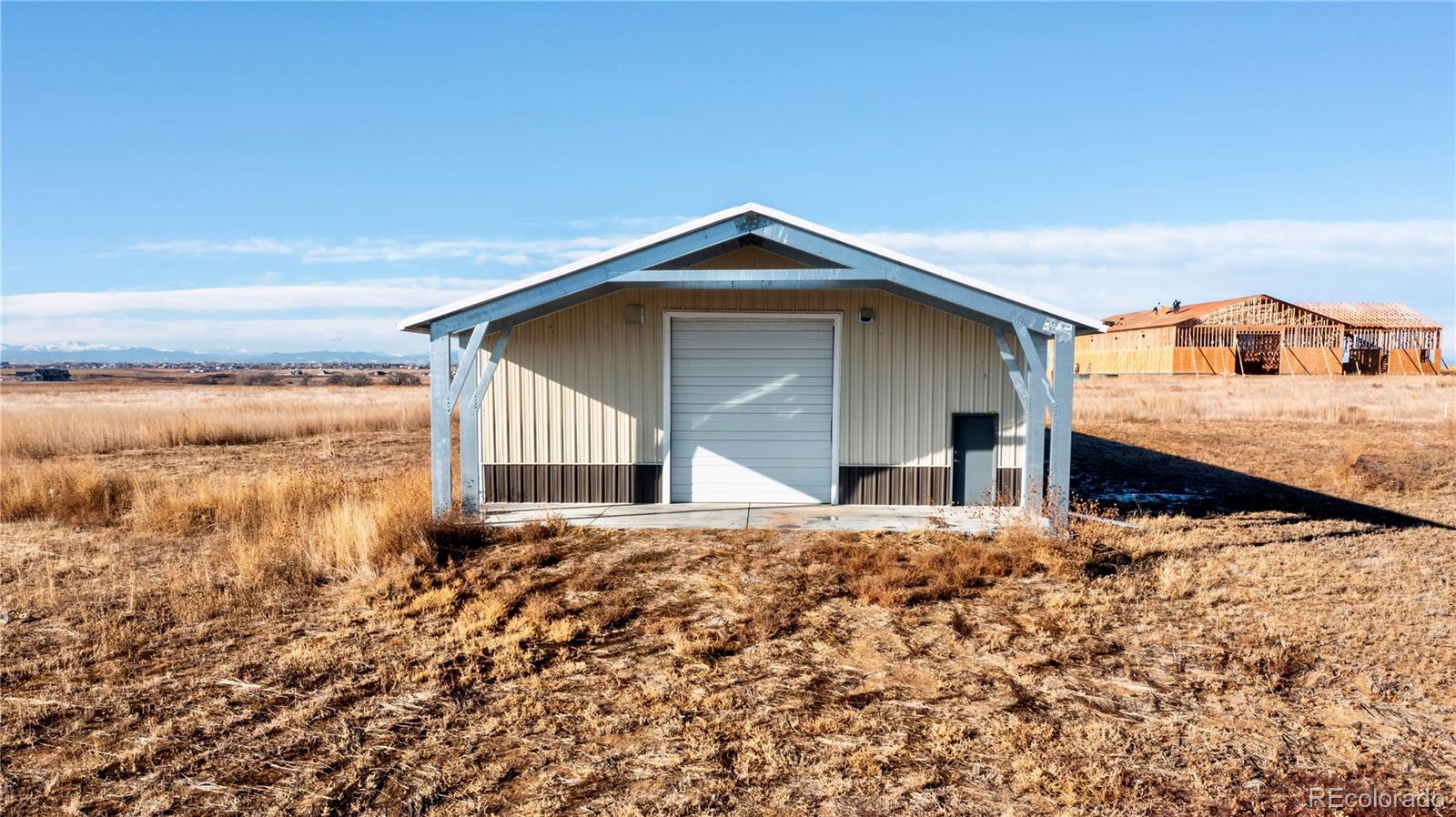 16590 Watkins Road Hudson, CO 80642 - Photo 13 of 30 a front view of a house with yard