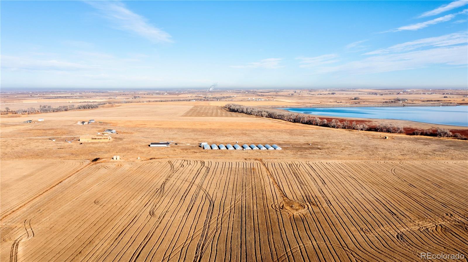 16590 Watkins Road Hudson, CO 80642 - Photo 18 of 30 a view of an ocean and beach