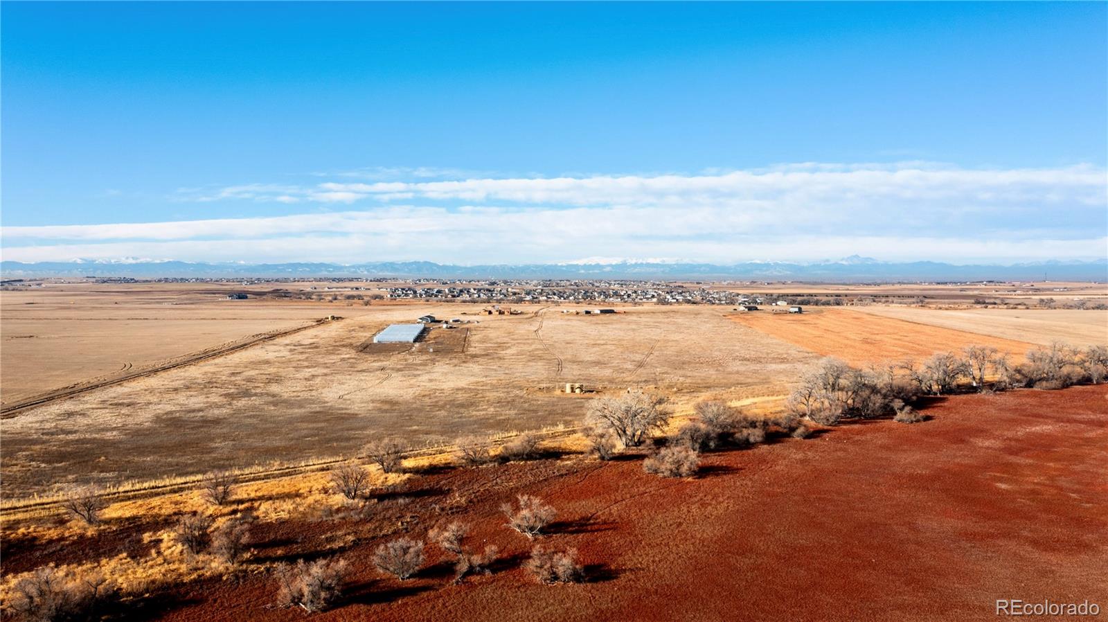 16590 Watkins Road Hudson, CO 80642 - Photo 22 of 30 a view of an ocean and beach