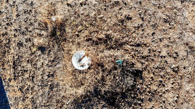 a view of a lake with houses in the back