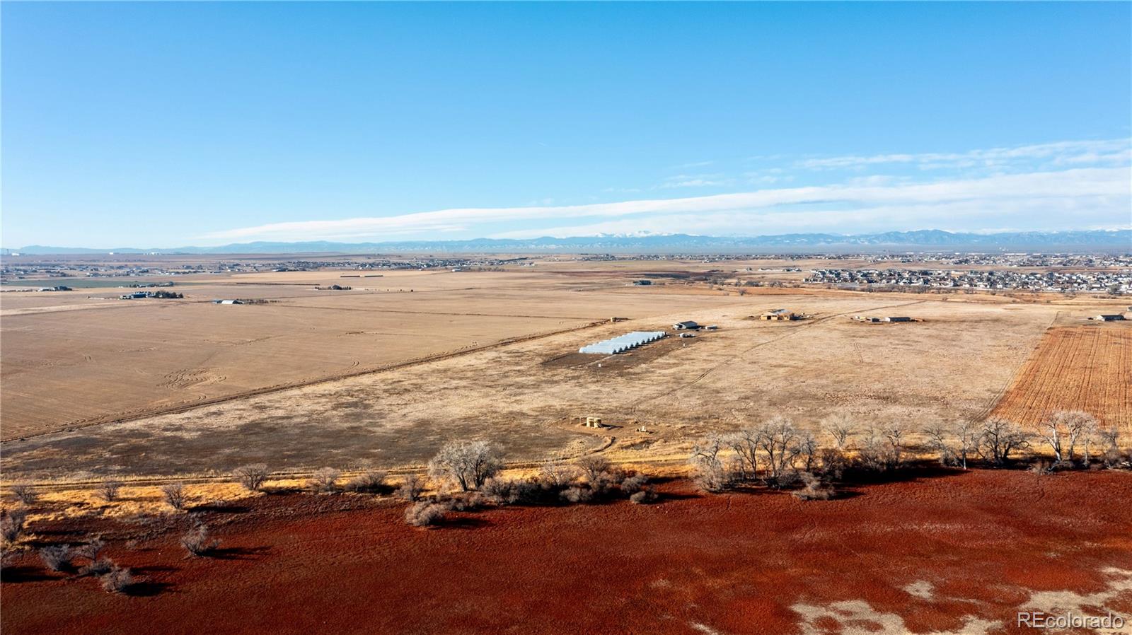 16590 Watkins Road Hudson, CO 80642 - Photo 5 of 30 an aerial view of ocean and residential houses with outdoor space