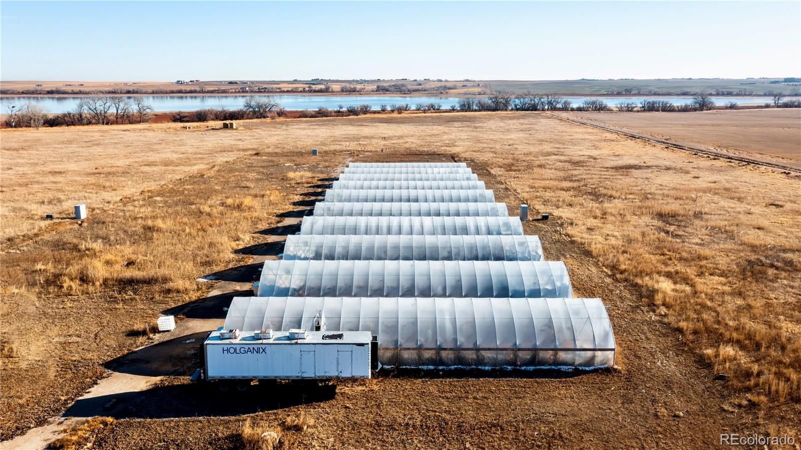 16590 Watkins Road Hudson, CO 80642 - Photo 10 of 30 a view of wooden floor with a terrace