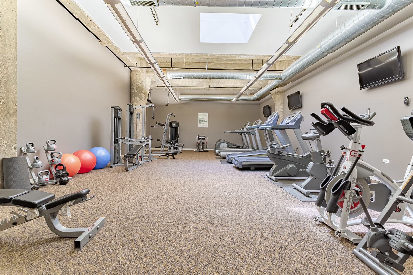 3963 West Belmont Avenue, Unit 117 Chicago, IL 60618 - Photo 11 of 13 a view of a room with gym equipment