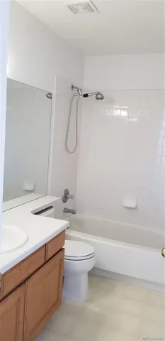 a bathroom with a sink a toilet and a bathtub