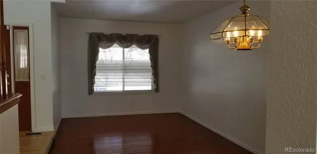 an empty room that has a window