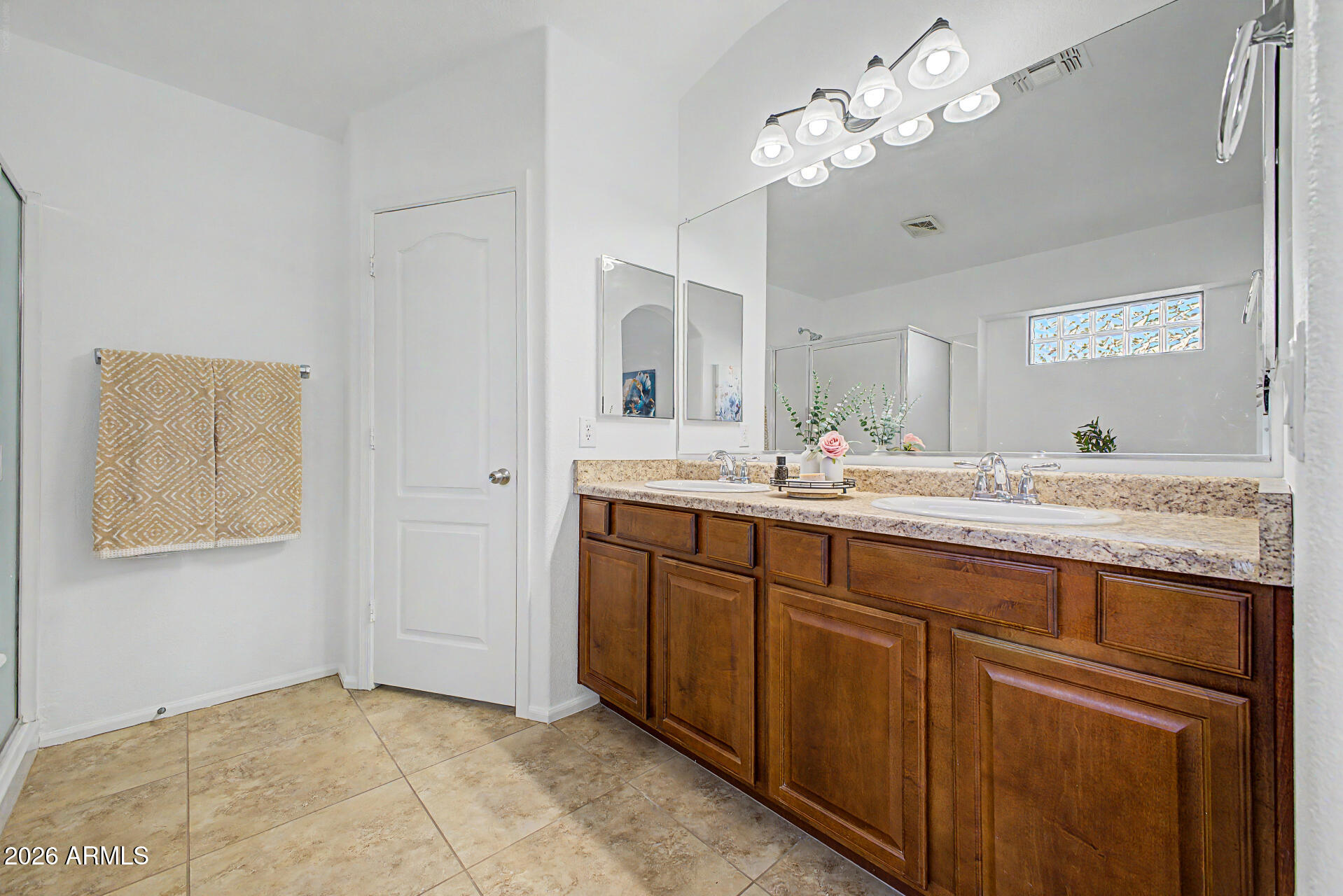 4168 East Sandy Way Gilbert, AZ 85297 - Photo 17 of 47 a bathroom with a double vanity sink and a mirror