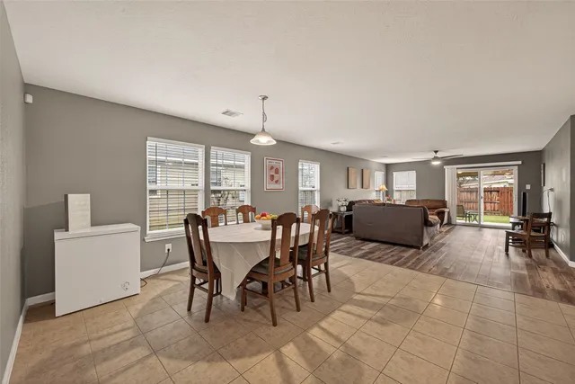 a view of a dining room with furniture and a livingroom
