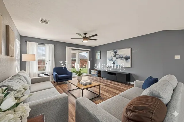a living room with furniture and a large window