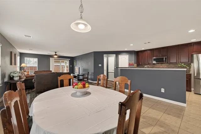 a kitchen with a table and chairs in it