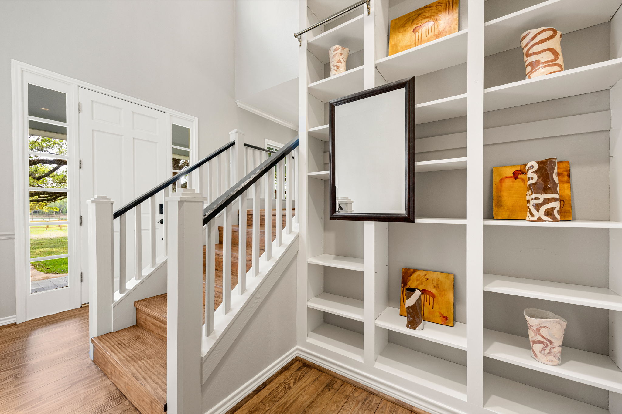 12900 Newberg Road Cat Spring, TX 78933 - Photo 21 of 39 Bookcases at entry way