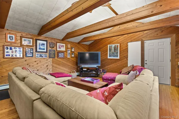 a living room with furniture and a floor to ceiling window