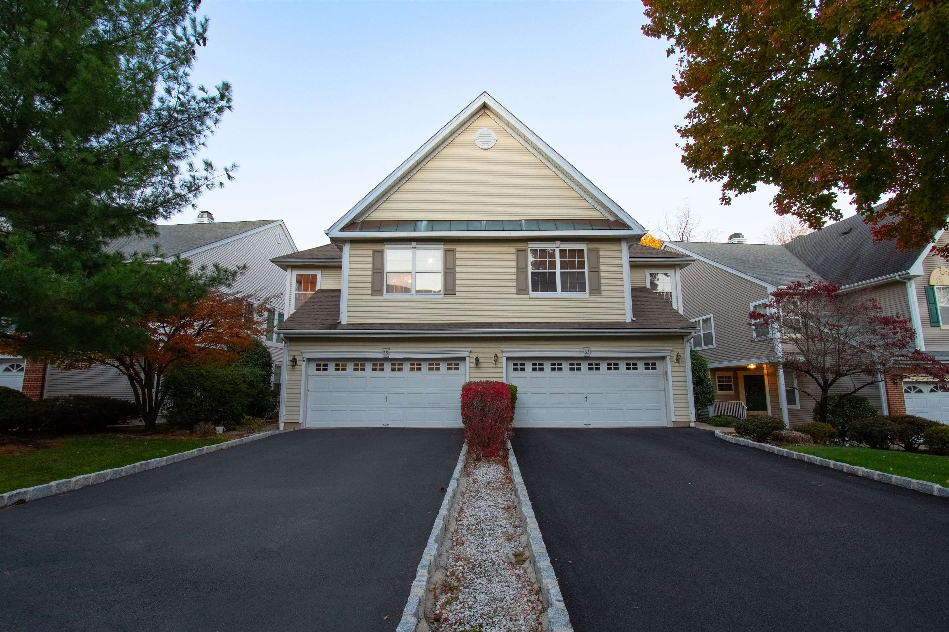 59 Morning Watch Road Wayne, NJ 07470 - Photo 2 of 12 a front view of a house with a yard