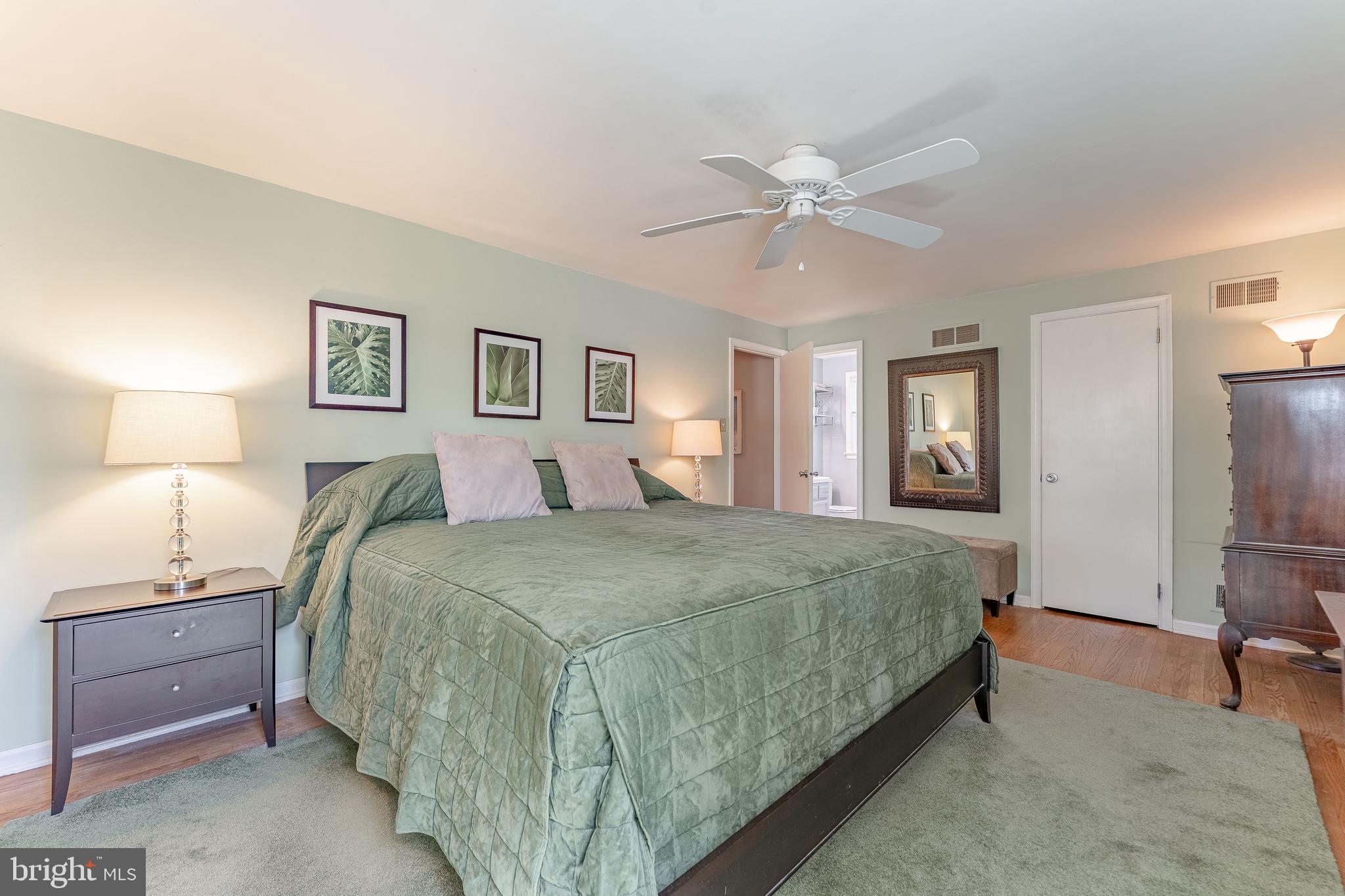 84 North Spring Lane Phoenixville, PA 19460 - Photo 28 of 51 a spacious bedroom with a bed and a lamp