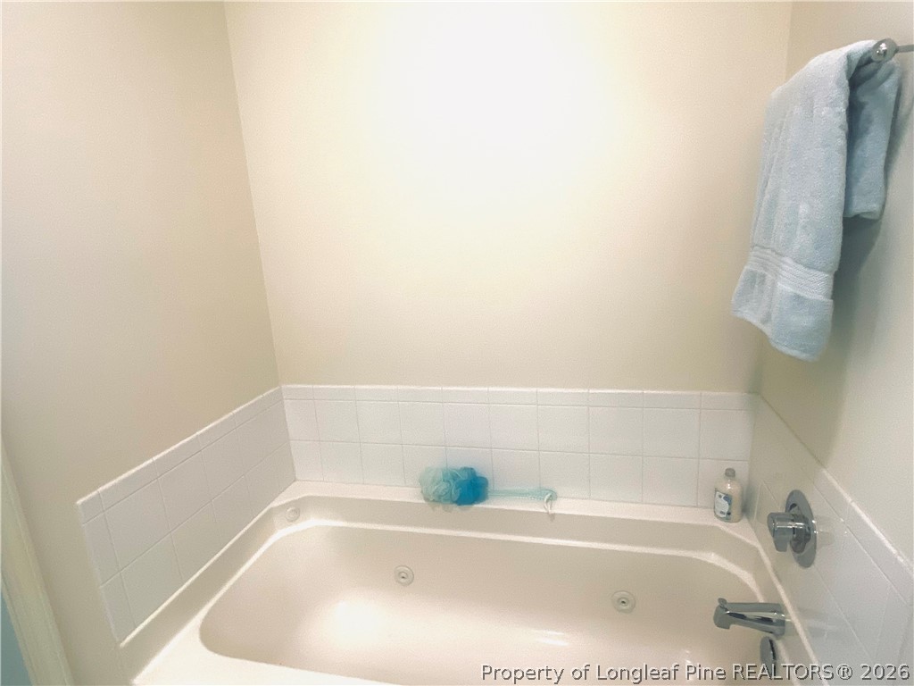 516 Lionshead Road, Unit 6 Fayetteville, NC 28311 - Photo 22 of 27 a white bath tub and shower