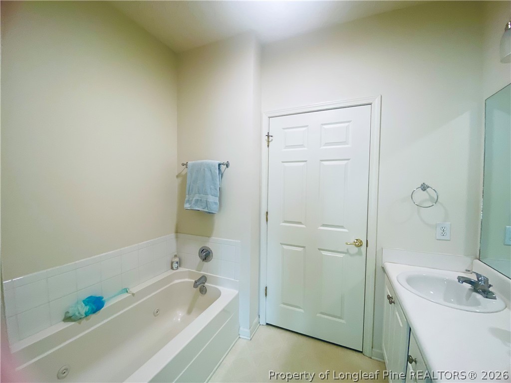 516 Lionshead Road, Unit 6 Fayetteville, NC 28311 - Photo 25 of 27 a bathroom with a tub a sink and a shower