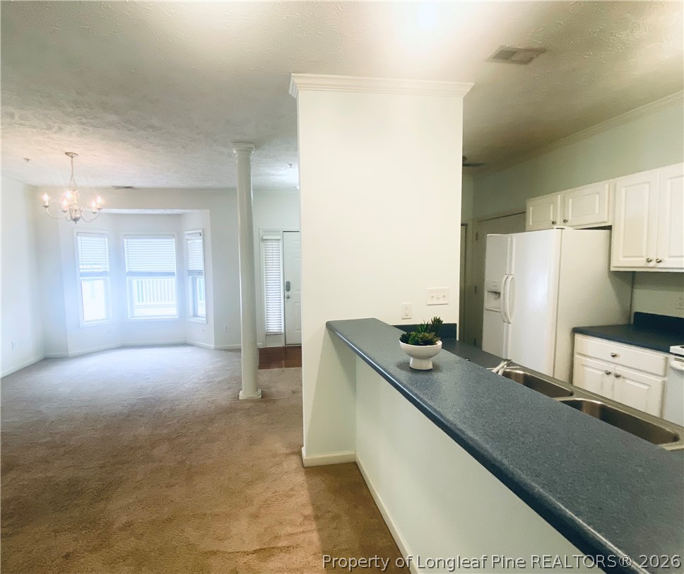 516 Lionshead Road, Unit 6 Fayetteville, NC 28311 - Photo 8 of 27 a kitchen with stainless steel appliances a refrigerator and a stove