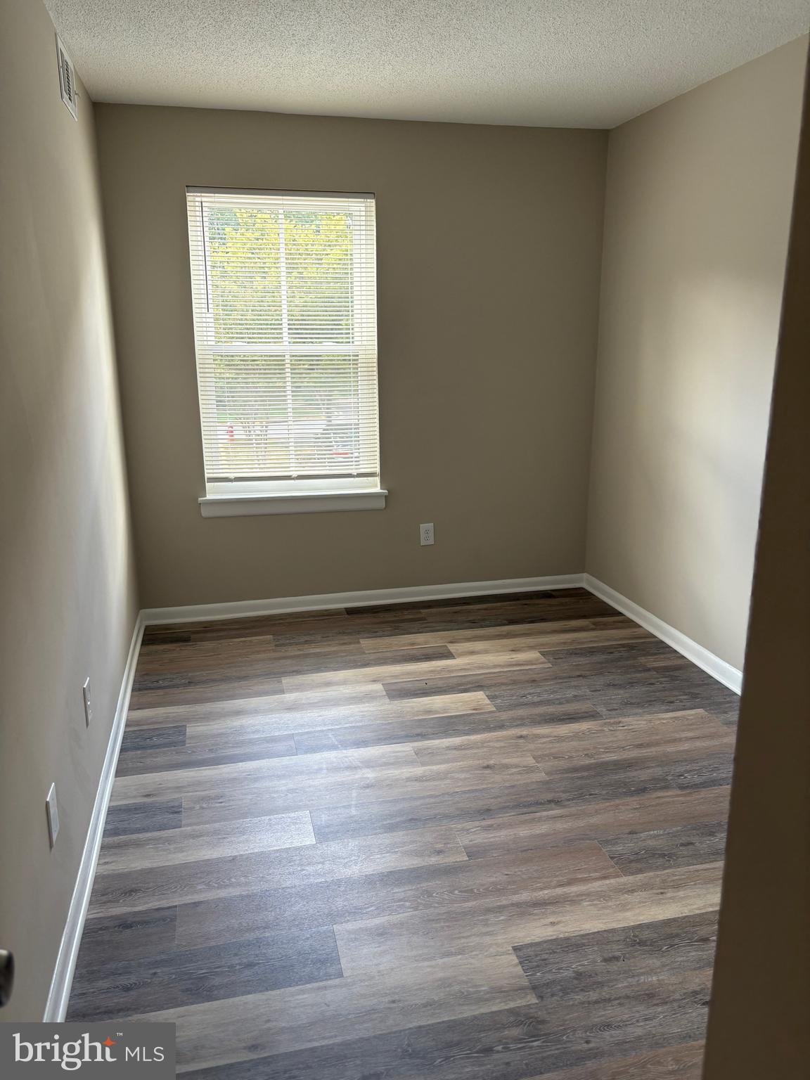 11611 Stoneview Square, Unit 70/12C Reston, VA 20191 - Photo 8 of 12 a view of wooden floor and windows in a room