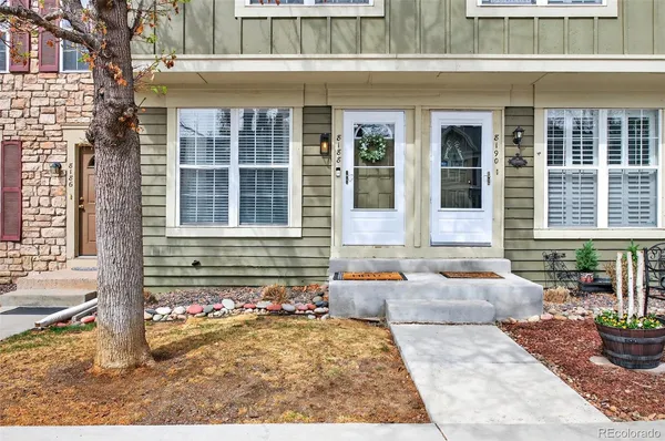 a front view of a house with a rug