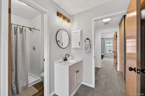 a en suite bathroom with a sink and a mirror