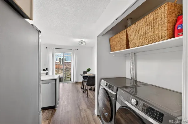 a view of kitchen and wooden floor
