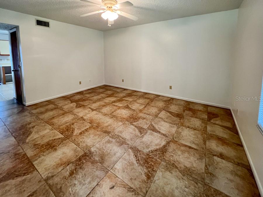 5601 Ave H, Unit 3 McIntosh, FL 32664 - Photo 11 of 21 an empty room with kitchen view