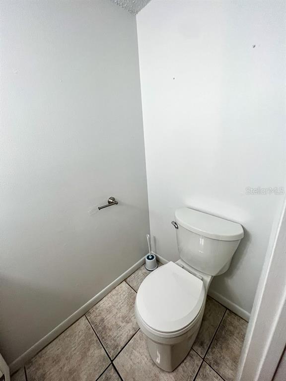 5601 Ave H, Unit 3 McIntosh, FL 32664 - Photo 4 of 21 a white toilet sitting next to a shower