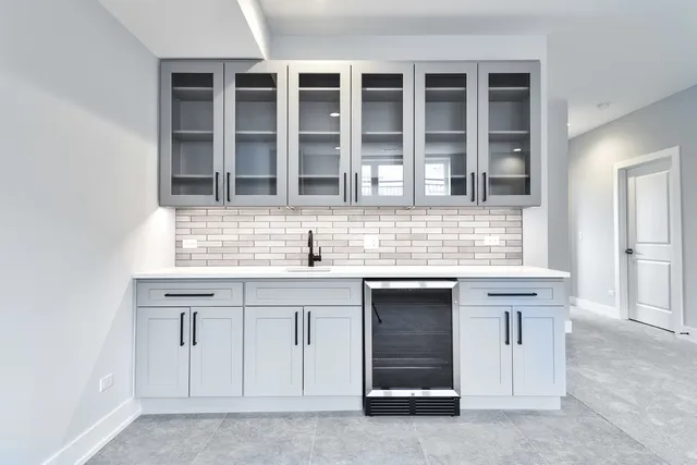 a view of kitchen with granite countertop a sink