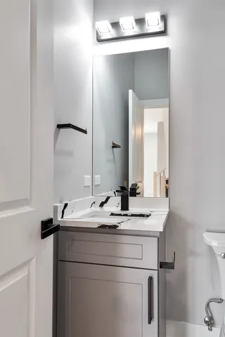 a bathroom with a sink and a mirror