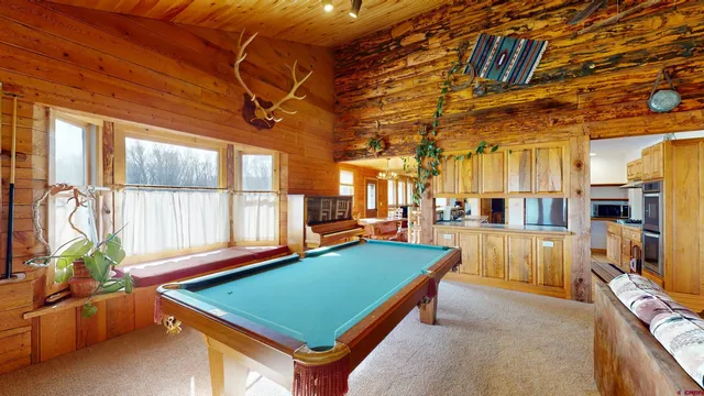 a room with furniture and large window