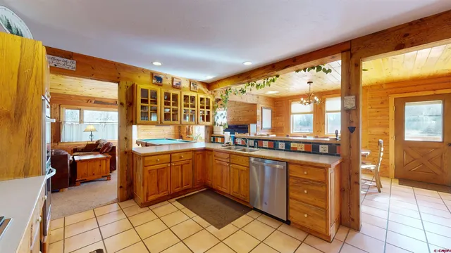 a kitchen with stainless steel appliances granite countertop sink and cabinets