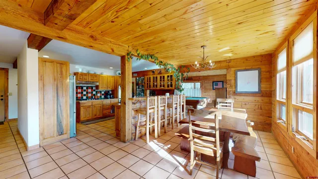 a view of a patio with a table and chairs