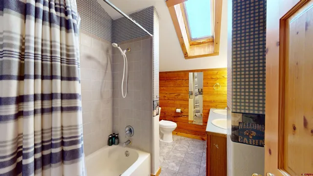 a bathroom with a bathtub and shower