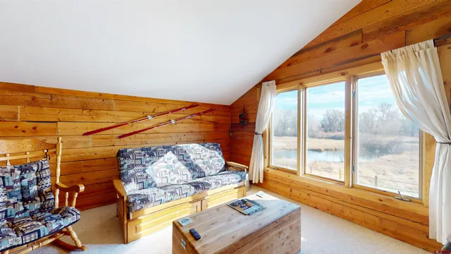 a bedroom with furniture and a window