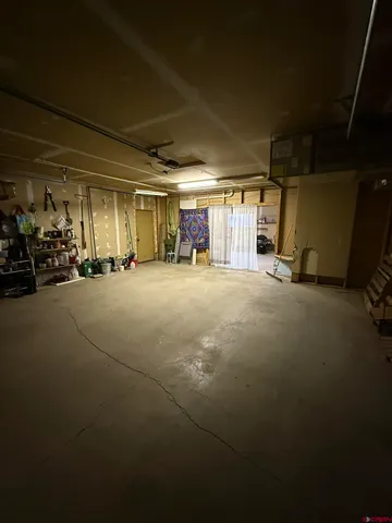 a view of a garage with parked cars