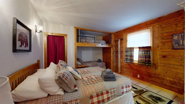 a bedroom with furniture and a window