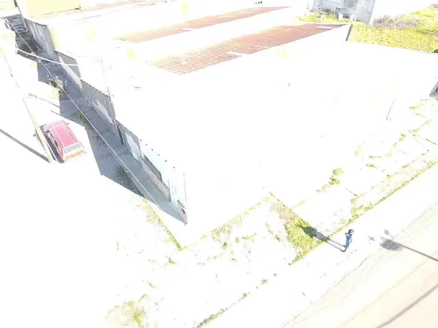 a view of ocean and a building