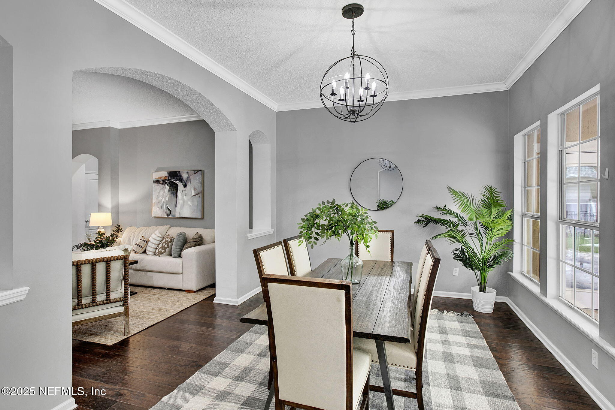 1961 Glenfield Crossing Court St. Augustine, FL 32092 - Photo 16 of 40 a view of a dining room with furniture a potted plant and wooden floor
